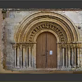 Ancient Stone Arched Entrance Gate With Historic Carvings And Decorative Stone Columns