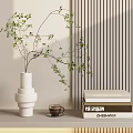 White Stacked Vase With Green Branches And Foliage Near Books And Coffee Cup