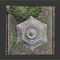 Traditional Stone Lantern With Carved Details And Green Bush On Grass Base