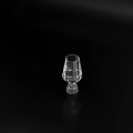 Transparent Glass Wine Glass With Slender Body And Wide Base On Black Tabletop
