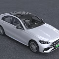 White Mercedes Benz Sedan With Sleek Front Design And Alloy Wheels