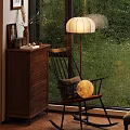 Cozy Wooden Rocking Chair With Pillow And Moon Decor By Window With Green View