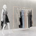 Gold Clothes Rack With Hanging Dresses And Dress Mannequin In Grey Room
