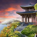 Traditional Chinese Pavilion By Lake With Sunset Sky Mountain Green Trees And People