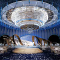Modern Blue Banquet Hall With Large Crystal Chandelier Central Stage Dining Tables And Elegant Decorations