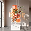 Orange Floral Installation With Geometric Decor And Light Shadow Effect In Modern Indoor Space