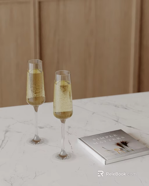 Decorative Ornament Set Featuring Two Champagne Glasses And Feather Decorated Book On Marble Countertop 3d model 