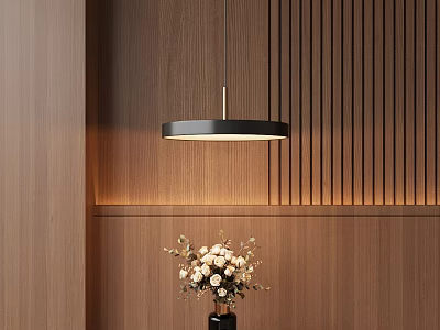 Modern Circular Pendant Light Hanging Over Wooden Wall With Flower Vase 3d model