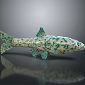 Green And White Spotted Fish With Black Eyes Green Tail And Fins On Black Background