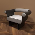 Contemporary Single Sofa Featuring Gray Cushion Black Round Armrests On Herringbone Wooden Floor