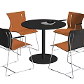 Modern Minimalist Round Table with Black Top and Orange Cushioned Chairs Silver Metal Legs