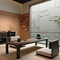 Japanese Style Tea Room With Dark Wood Table Cushioned Seats Wall Art And Tea Sets