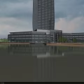 Modern High Rise Office Building with Glass Curtain Wall Waterfront Reflection and Surrounding Trees