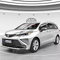 Toyota Silver MPV Car Displayed In Modern Showroom With Logo Background