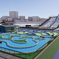 Vibrant Water Park With Winding Channels Slides And Urban Background Facilities