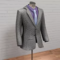 Three Classic Formal Suits On Mannequins With Brick Wall And Wooden Floor