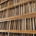 Natural Wood Partition Interior Design With Vertical Slats And Layered Structure