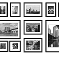 Modern Black And White Photo Wall With Various Sized Frames And Cityscape 3d model