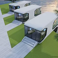 Modern White Guesthouse Buildings With Glass Windows By Waterfront Lawn And Palm Trees