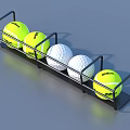 Sports Equipment Metal Rack Holding Yellow Wilson Tennis Balls And White Golf Balls