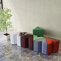 Colorful Geometric Shaped Stools with Modern Design on Marble Floor and Green Plant