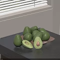 Fresh Ripe Avocados Halved With Pit On Plate Dark Table By Window