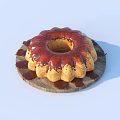 Freshly Baked Golden Brown Bundt Cake with Red Glaze on Wooden Platter