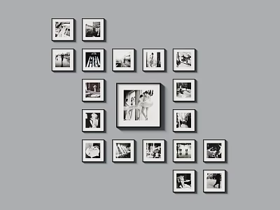 Creative Photo Wall with Black and White Framed Photos and Central Large Frame 3d model