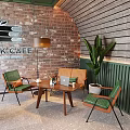 Cozy Cafe Setting With Brick Wooden Walls Floor Lamp Green Plant Brown Table Green Chairs
