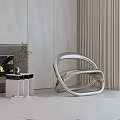 Modern Silver Leisure Chair With Curved Design In Minimalist Living Room Interior