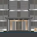 Modern Building Entrance Gate With Glass Doors And Surrounding Greenery