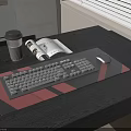 Modern Dark Desk Setup With Keyboard Mouse Pad Coffee Cup And Magazine