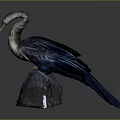 Flying Animal Bird Sculpture with Blue Brown Feathers Perched on Rock Against Gray Background