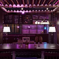 Elegant Dark Bar Interior With Brick Walls Purple Lighting And Wine Racks