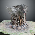 Natural Plant Structure Made of Branches and Vines on Grass with Stones Base