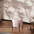 Pink Round Leisure Chair with Wooden Legs on Wooden Floor White Wall and Plant Shadows