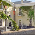 Detached Villa With Yellow Exterior Climbing Vines Balconies Roof Chimneys And Courtyard Clothesline