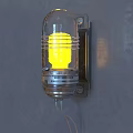 Vintage Metal Wall Lamp With Transparent Glass Shade Yellow Light On Gray Wall