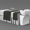Professional Salon Massage Bed With White Sheets Green Towels And Side Basin