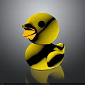 Cute Yellow Rubber Duck Toy with Orange Beak on Dark Reflective Surface