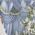 Bridal Photo Check In Spot With Blue Curtain White Flowers And Greenery Decorations