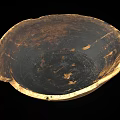 Ancient Pottery Bowl With Chipped Edges And Black Brown Textured Surface
