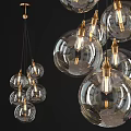 Modern Transparent Glass Pendant Lights With Golden Metal Accents And Spherical Design