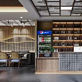 Elegant Reception Desk Area With Wooden Paneling Shelves Decor Pepsi Fridge And Seating