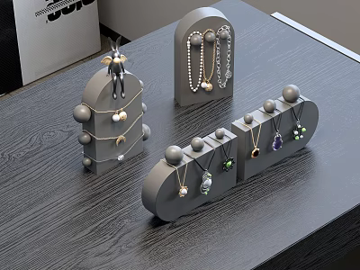 Stylish Jewelry Display On Gray Stands With Various Necklaces Earrings 3d model