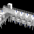 Industrial Equipment With Stainless Steel Tanks And Mixers On Multi Level Platforms With Railings