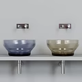 Modern Glass Washbasins Blue And Brown Design On White Shelf With Silver Faucets Above