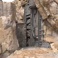 Rock Enclosed Metal Door With Industrial Mechanical Frames And Rustic Details