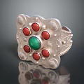 Silver Ring Featuring Central Green Gemstone with Red Gemstones and Decorative Pearl like Dots