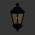 Black Decorative Lantern With Ornamental Top And Warm Yellow Light For Home Decoration